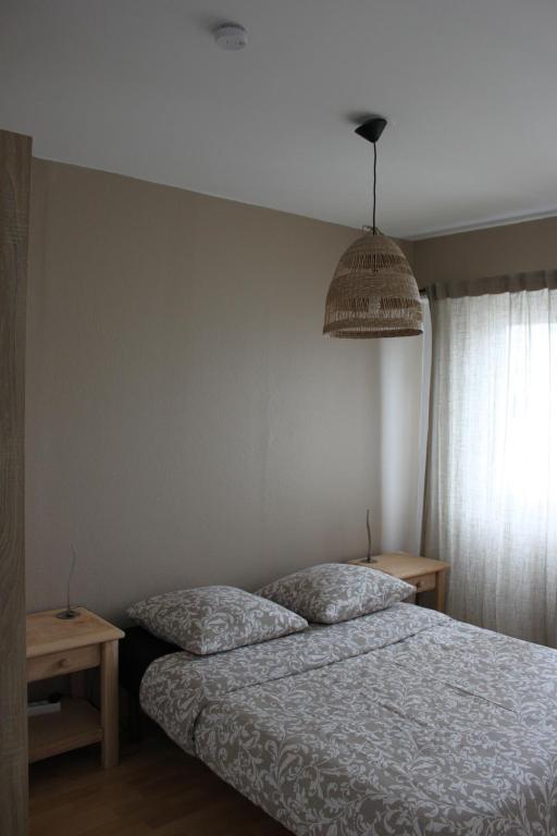 Postel nebo postele na pokoji v ubytování Cosy F2 Basel Saint-Louis
