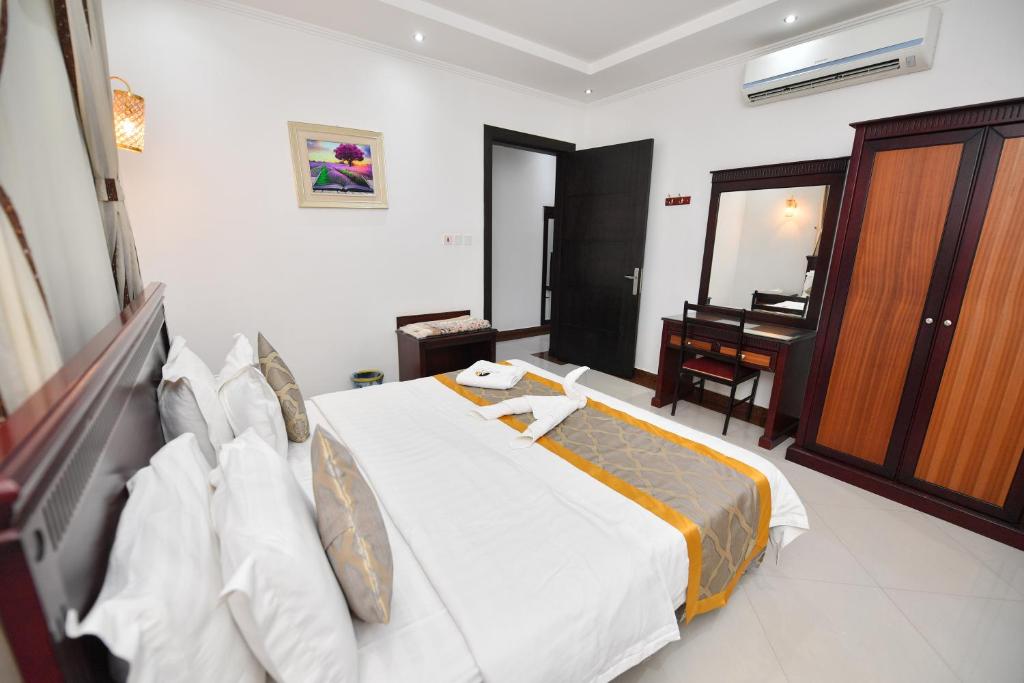Postel nebo postele na pokoji v ubytování Aseel Alsharq Hotel