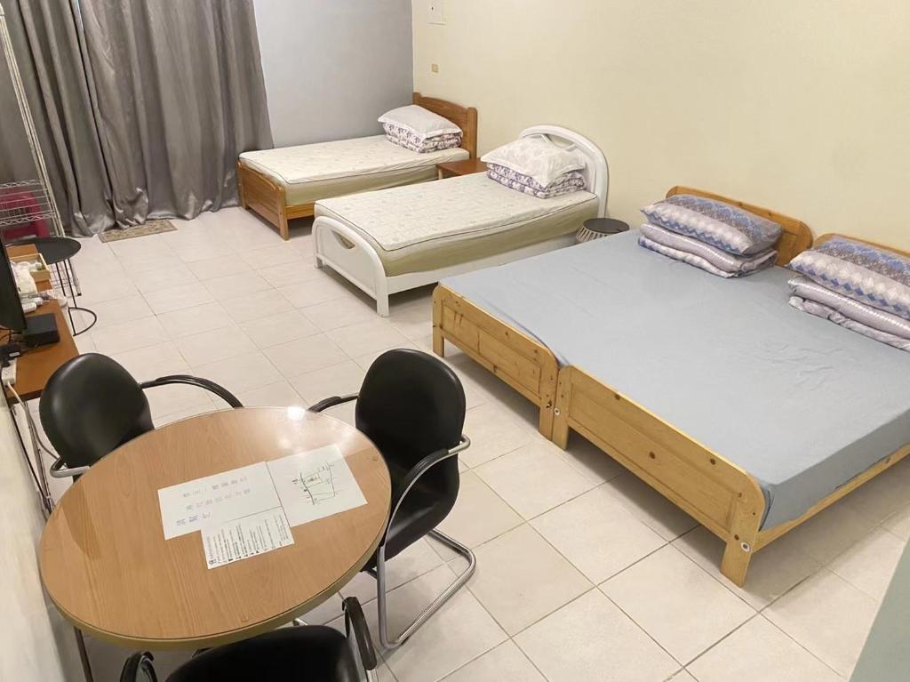 Postel nebo postele na pokoji v ubytování 彰濱伸港民宿