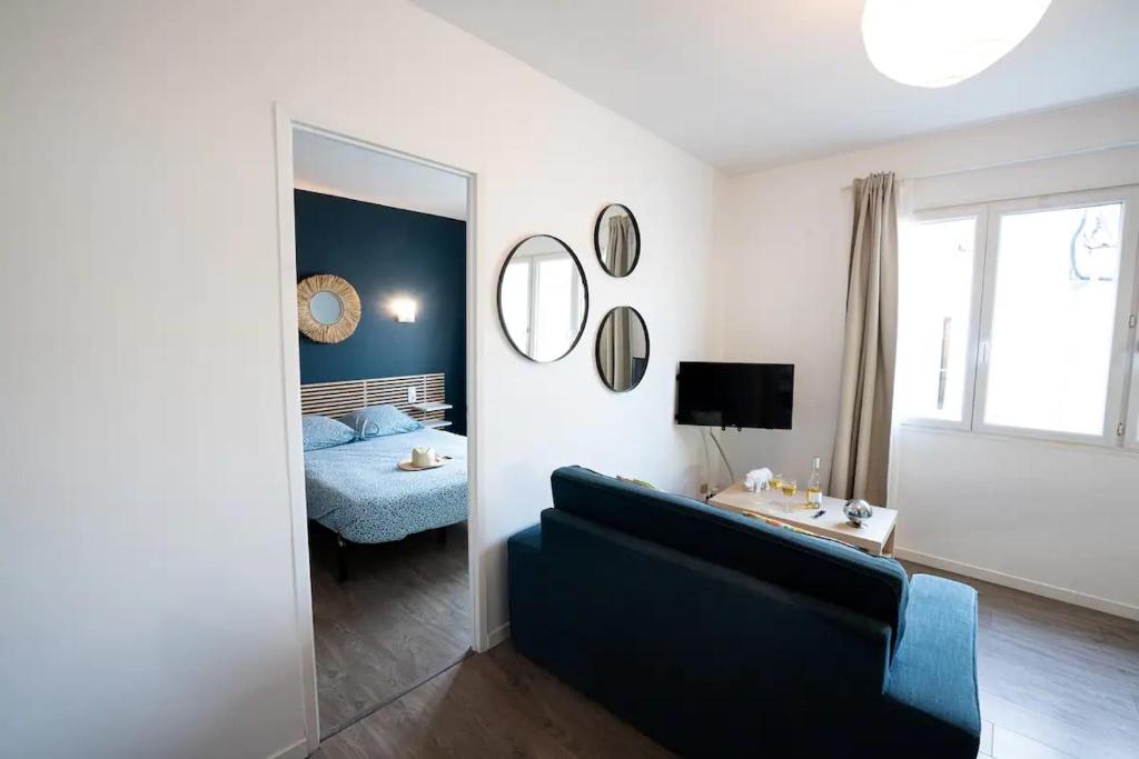 Posteľ alebo postele v izbe v ubytovaní Appartement centre village, clim et parking gratuit