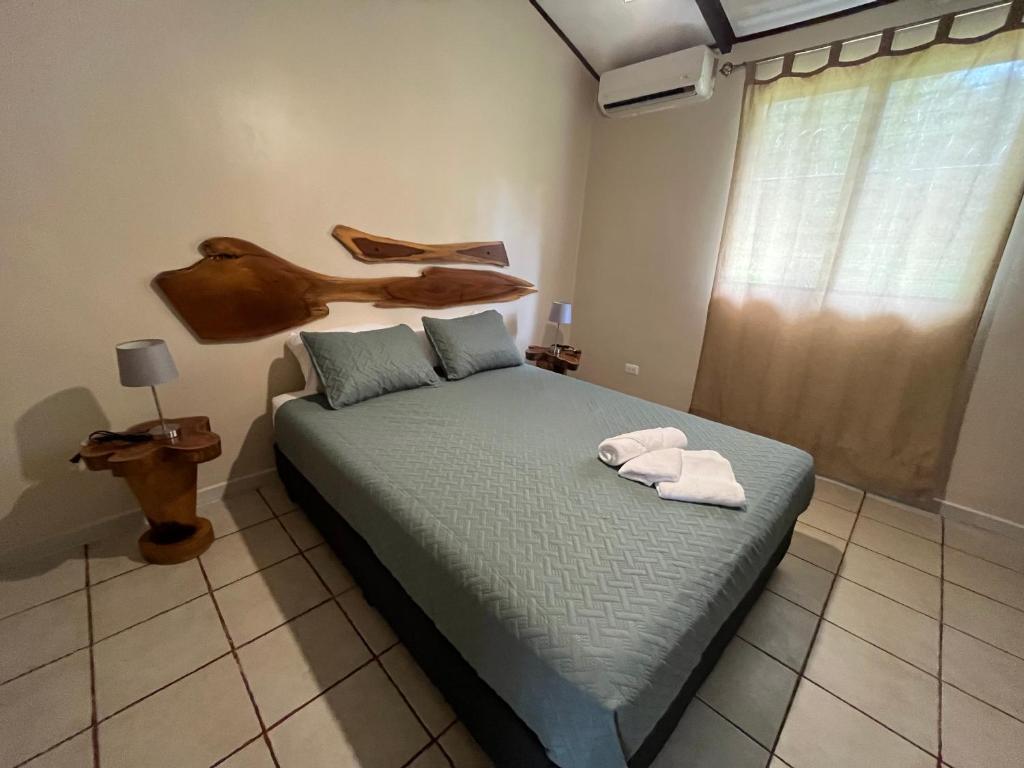 Postel nebo postele na pokoji v ubytování Casa Tropical Playa Grande
