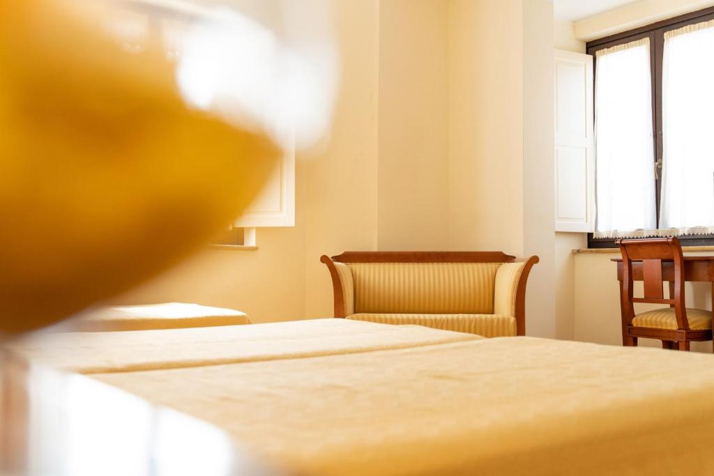 Postel nebo postele na pokoji v ubytování Hotel Ristorante Vecchia Vibo