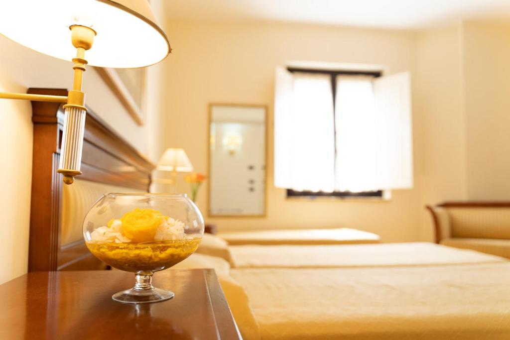 Postel nebo postele na pokoji v ubytování Hotel Ristorante Vecchia Vibo