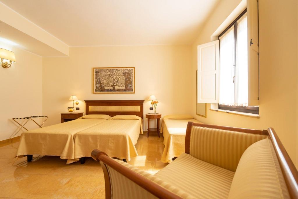 Postel nebo postele na pokoji v ubytování Hotel Ristorante Vecchia Vibo