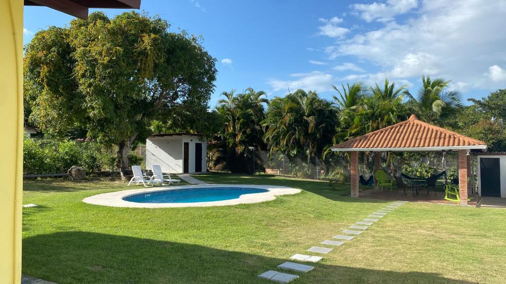 a backyard with a small pool and a gazebo at CORONADO VILLA VICTORIA in San Carlos