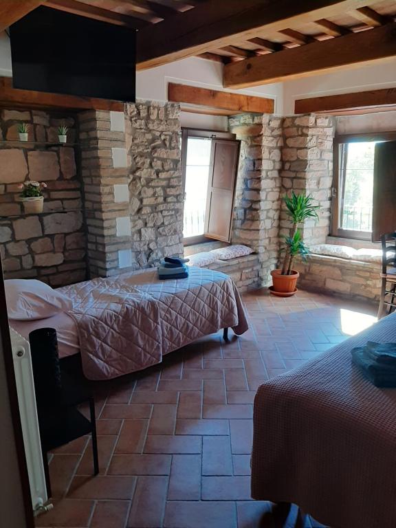 Säng eller sängar i ett rum på Bed & Breakfast Villa Monterosso