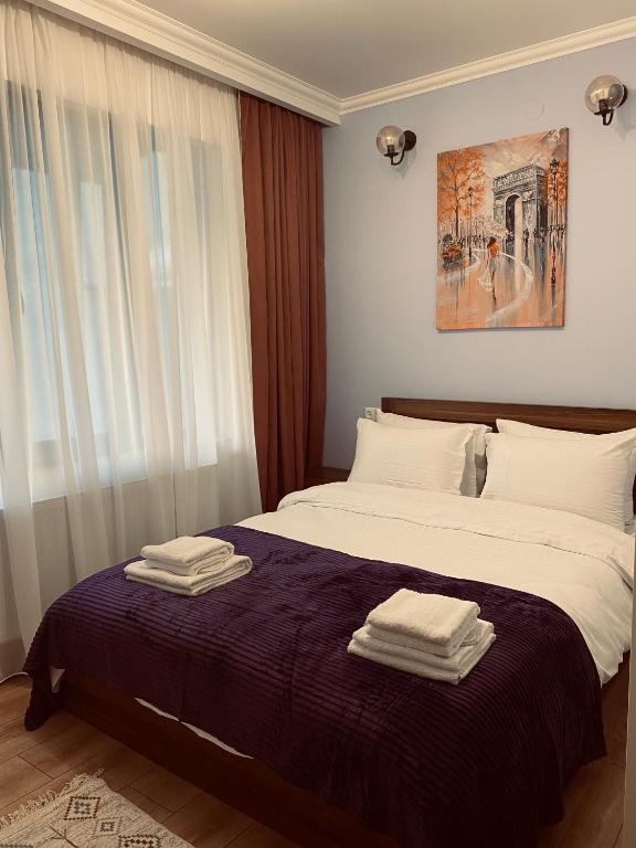Postel nebo postele na pokoji v ubytování Guesthouse Relax in Kazbegi