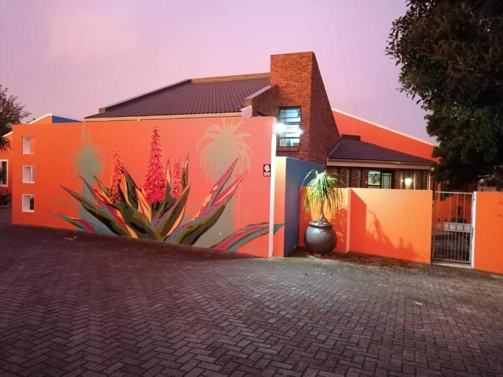 a building with a mural on the side of it at Studio 7 on Risa in Port Elizabeth