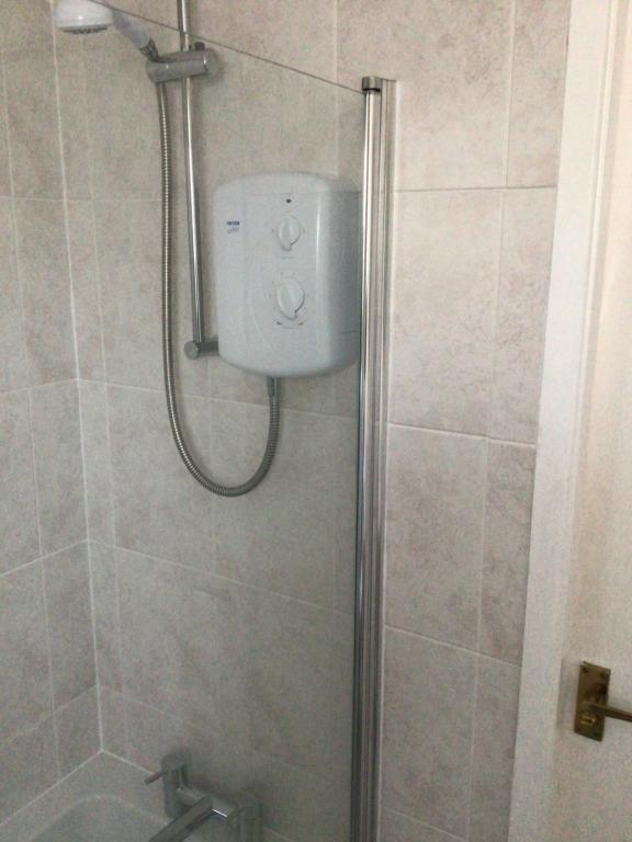 a bathroom with a shower with a toilet in it at Bobs plac in Whitehaven
