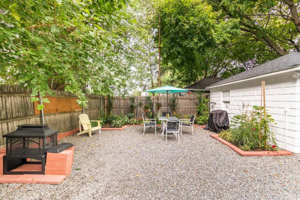 a backyard with a table and chairs and an umbrella at 521 Smith Steet LLC in Providence
