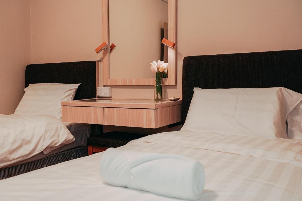 Postel nebo postele na pokoji v ubytování Gee homestay