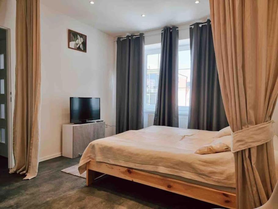 Posteľ alebo postele v izbe v ubytovaní Útulný byt v super lokalite
