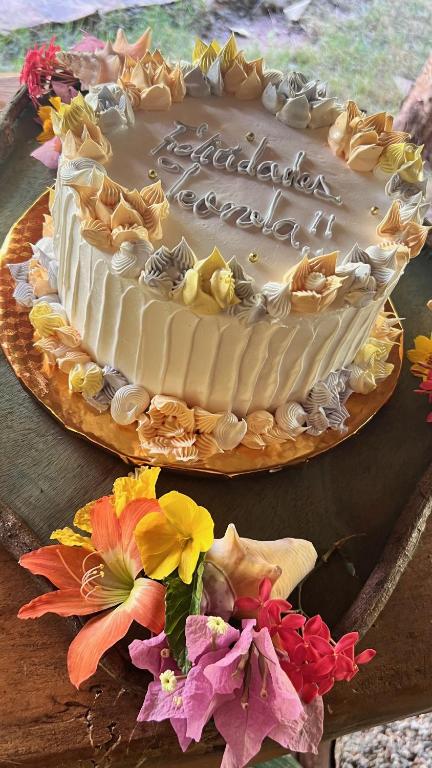 a birthday cake sitting on top of a table at CHALET TROPICAL Hotel & Restaurant-Pizzeria in Las Galeras