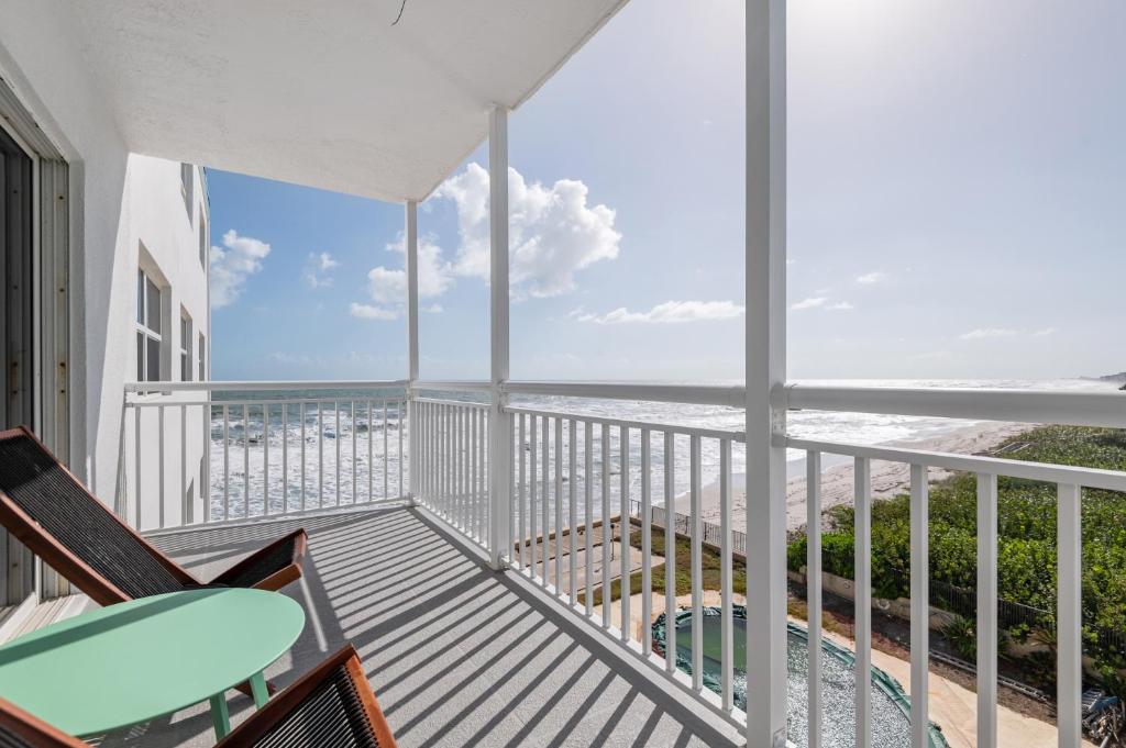 a balcony with a view of the ocean at Oceanfront Beach House, Satellite Beach in Satellite Beach