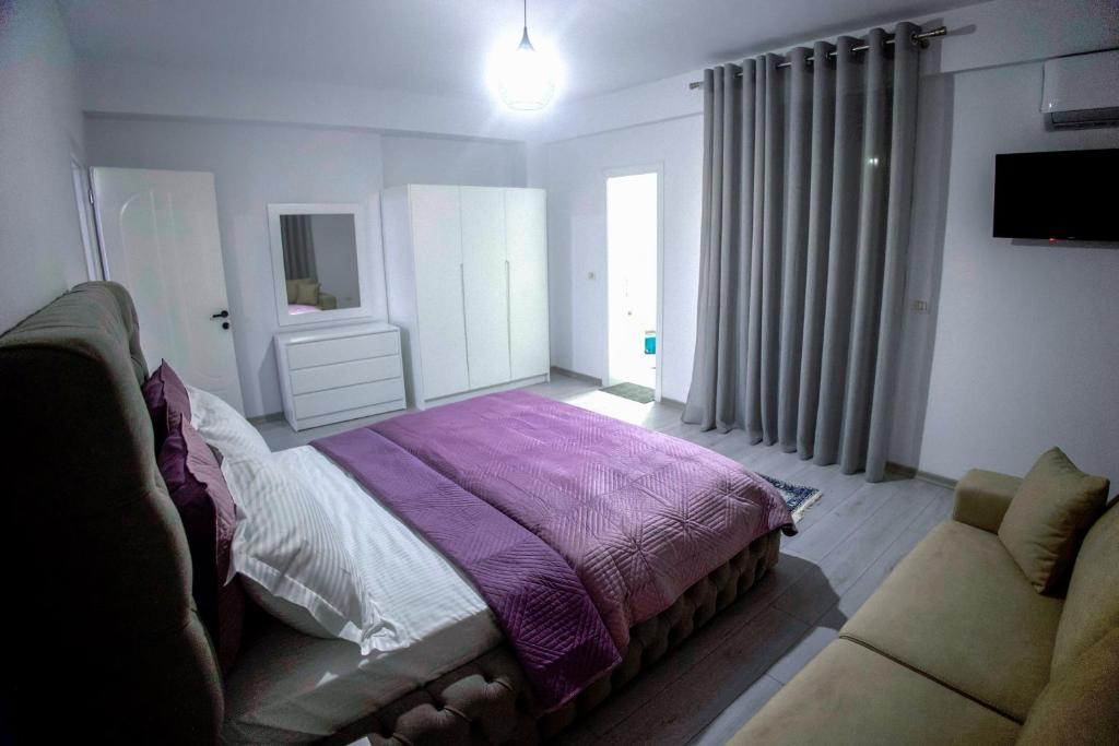 Postel nebo postele na pokoji v ubytování GRANDE APARTMENT KORCE