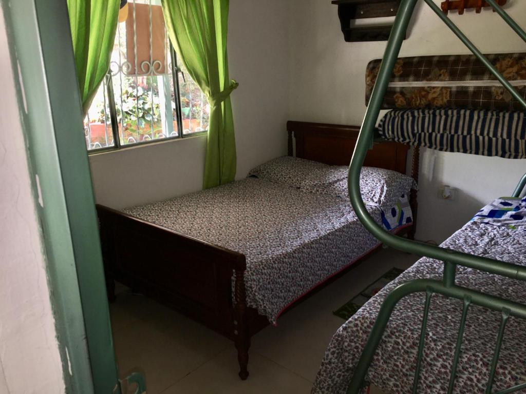 Postel nebo postele na pokoji v ubytování Finca La Belleza-Villeta