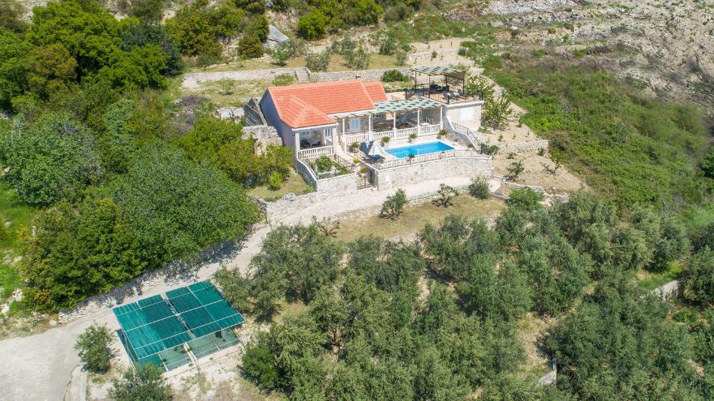 an aerial view of a house with a solar array at Holiday Villa Natura in Orebić