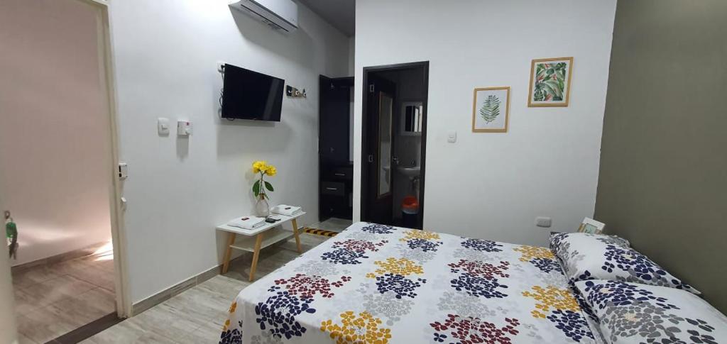 Giường trong phòng chung tại Como en casa