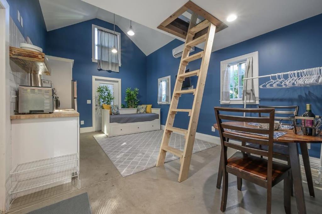 a kitchen with blue walls and a ladder in a room at Blue Bay Suite! Near Downtown and Foodie Hot Spots in Tampa