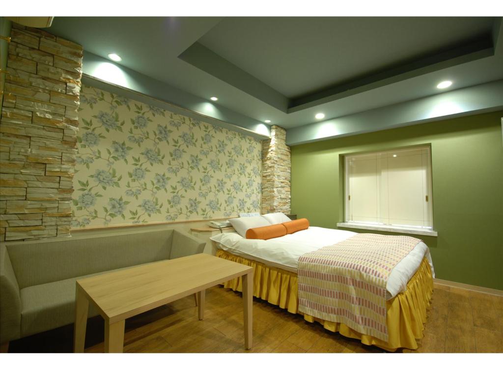 Postel nebo postele na pokoji v ubytování HOTEL K's MINE