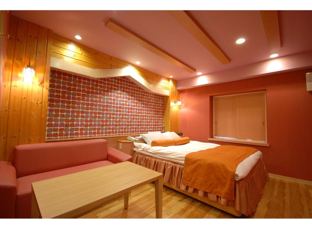 Postel nebo postele na pokoji v ubytování HOTEL K's MINE