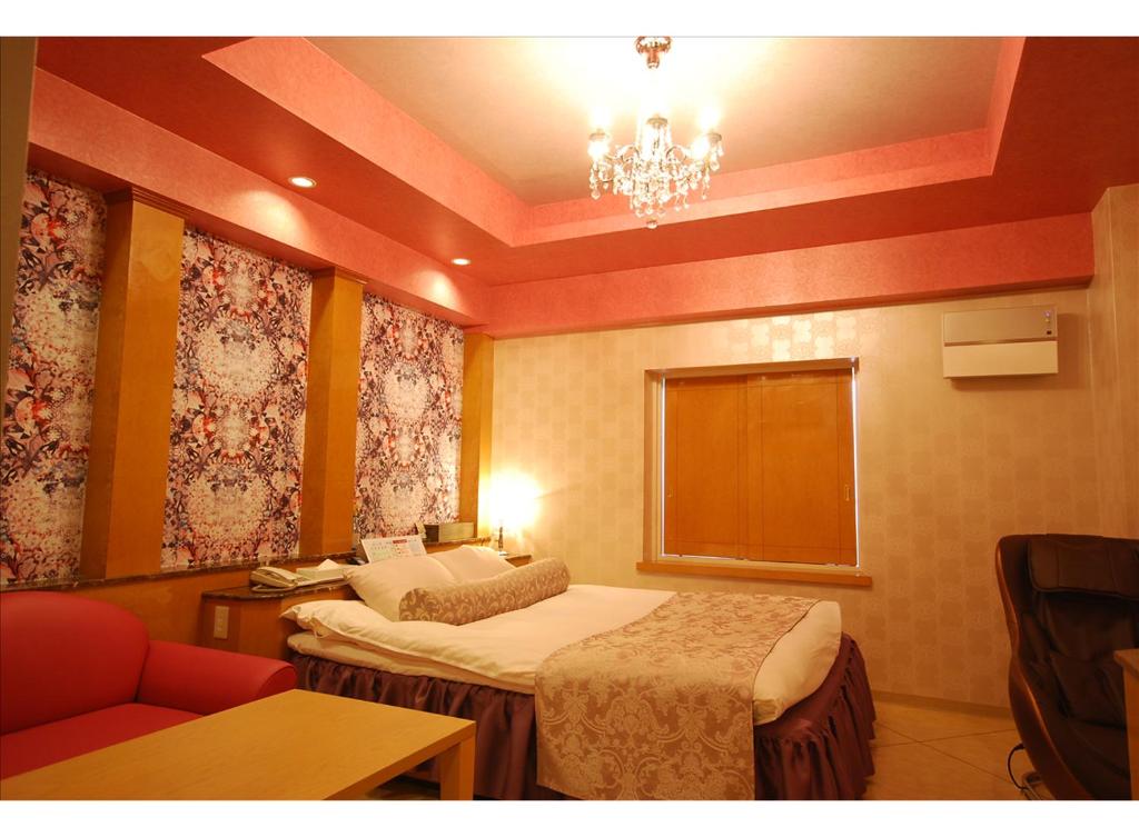 Postel nebo postele na pokoji v ubytování HOTEL K's MINE