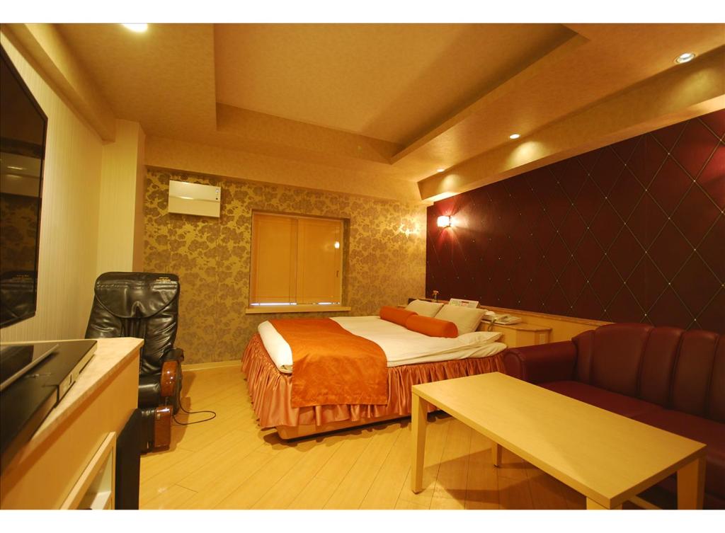 Postel nebo postele na pokoji v ubytování HOTEL K's MINE