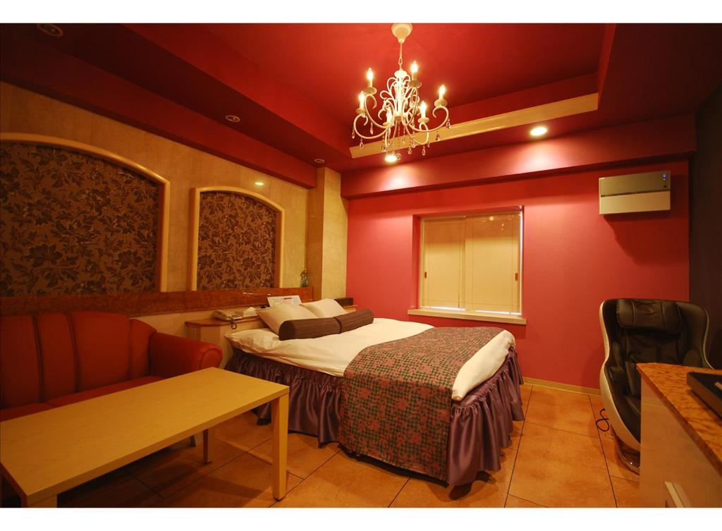 Postel nebo postele na pokoji v ubytování HOTEL K's MINE