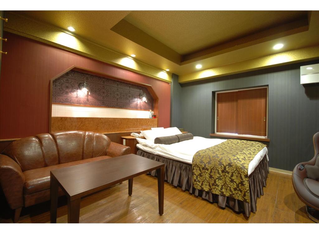 Postel nebo postele na pokoji v ubytování HOTEL K's MINE