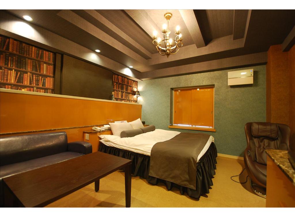 Postel nebo postele na pokoji v ubytování HOTEL K's MINE