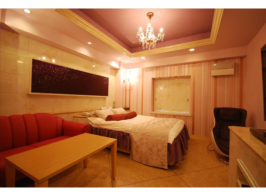 Postel nebo postele na pokoji v ubytování HOTEL K's MINE