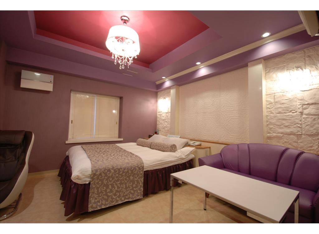 Postel nebo postele na pokoji v ubytování HOTEL K's MINE