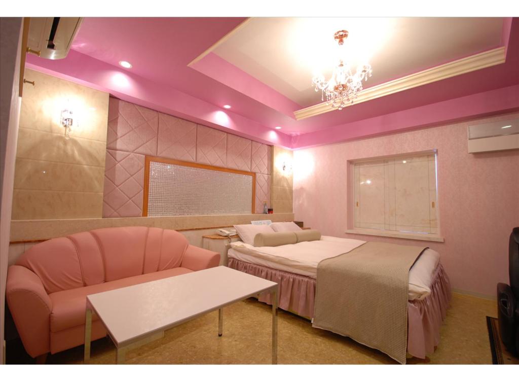 Postel nebo postele na pokoji v ubytování HOTEL K's MINE