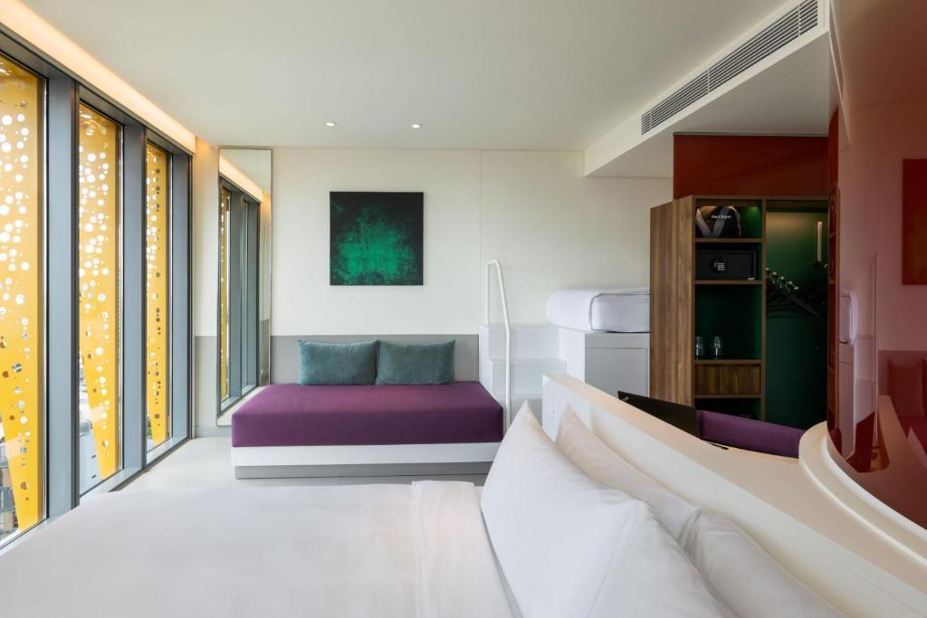Postel nebo postele na pokoji v ubytování Wink Hotel Danang Centre - 24hrs Lifestyle Stay