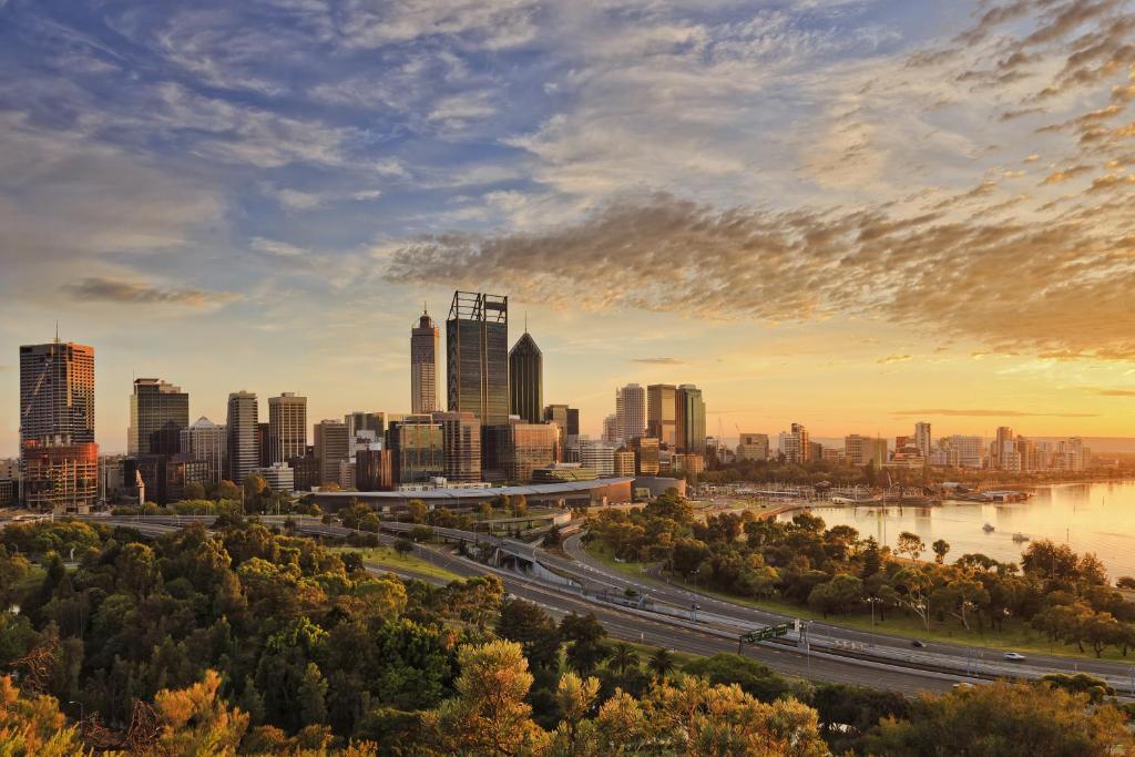 a view of a city skyline at sunset at Wonil Hotel Perth - Handwritten Collection in Perth
