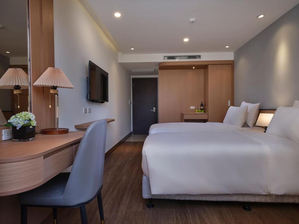 TV a/nebo společenská místnost v ubytování Minasi Hotel & Spa