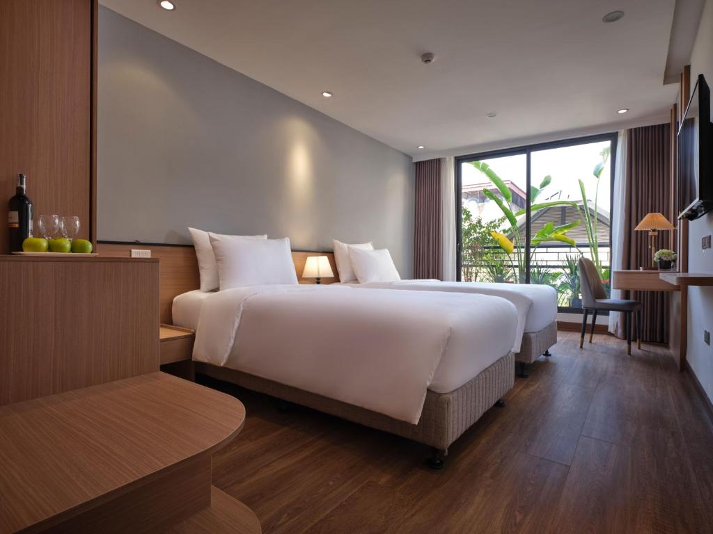 Postel nebo postele na pokoji v ubytování Minasi Hotel & Spa