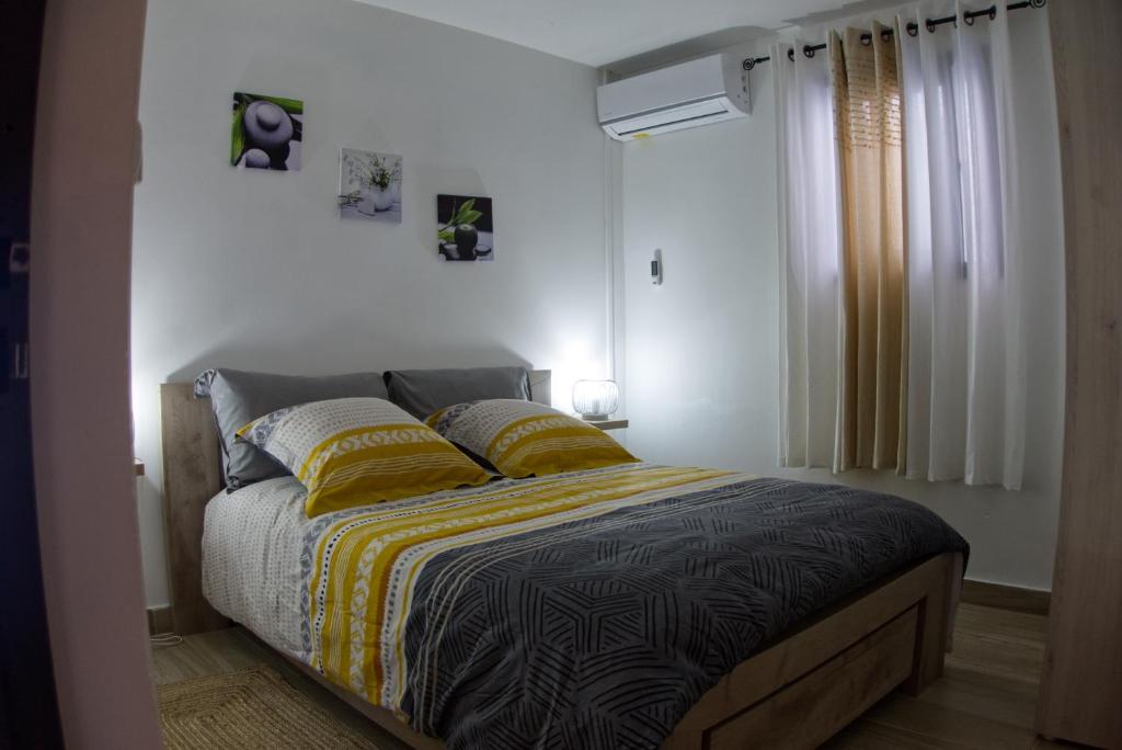 Postel nebo postele na pokoji v ubytování Ka Hema - Maison entière avec Jacuzzi et vue sur mer