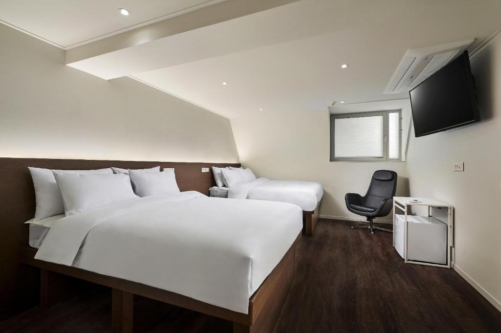 Cama ou camas em um quarto em H HOSTEL Itaewon