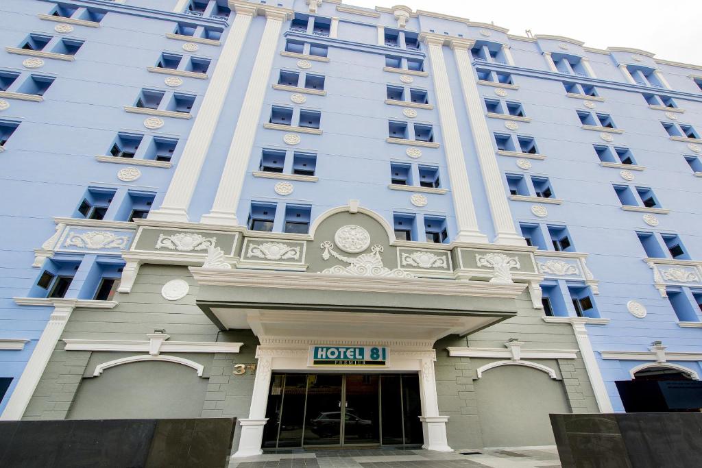 a large white building with a hotel in front of it at Hotel 81 Premier Star in Singapore