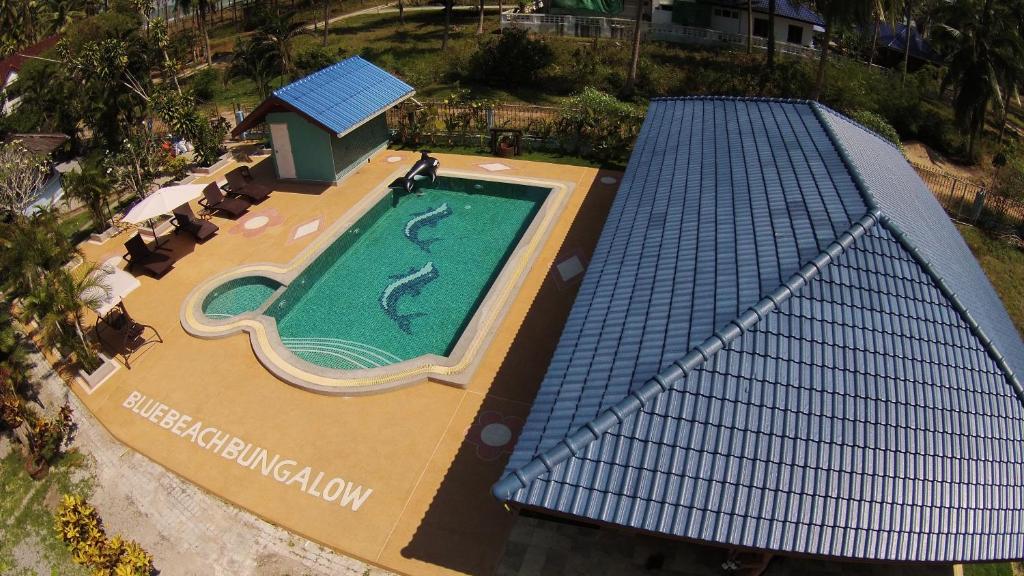 an overhead view of a swimming pool in a resort at Blue Beach Bungalow in Bang Saphan Noi