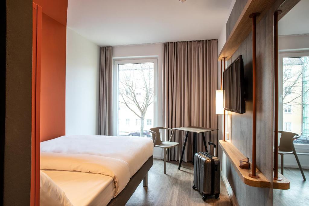 Postel nebo postele na pokoji v ubytování ibis budget Bayreuth