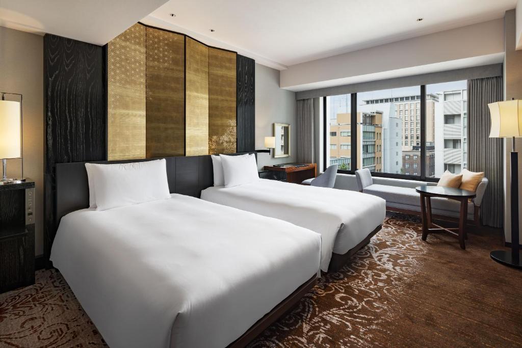 Postel nebo postele na pokoji v ubytování Hyatt Regency Yokohama