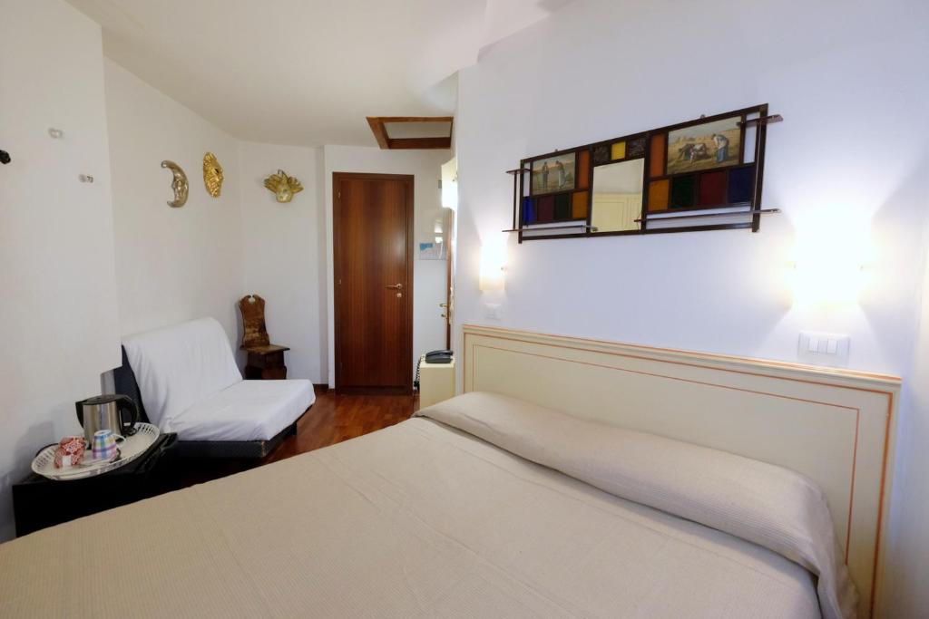 Postel nebo postele na pokoji v ubytování Hotel ai do Mori
