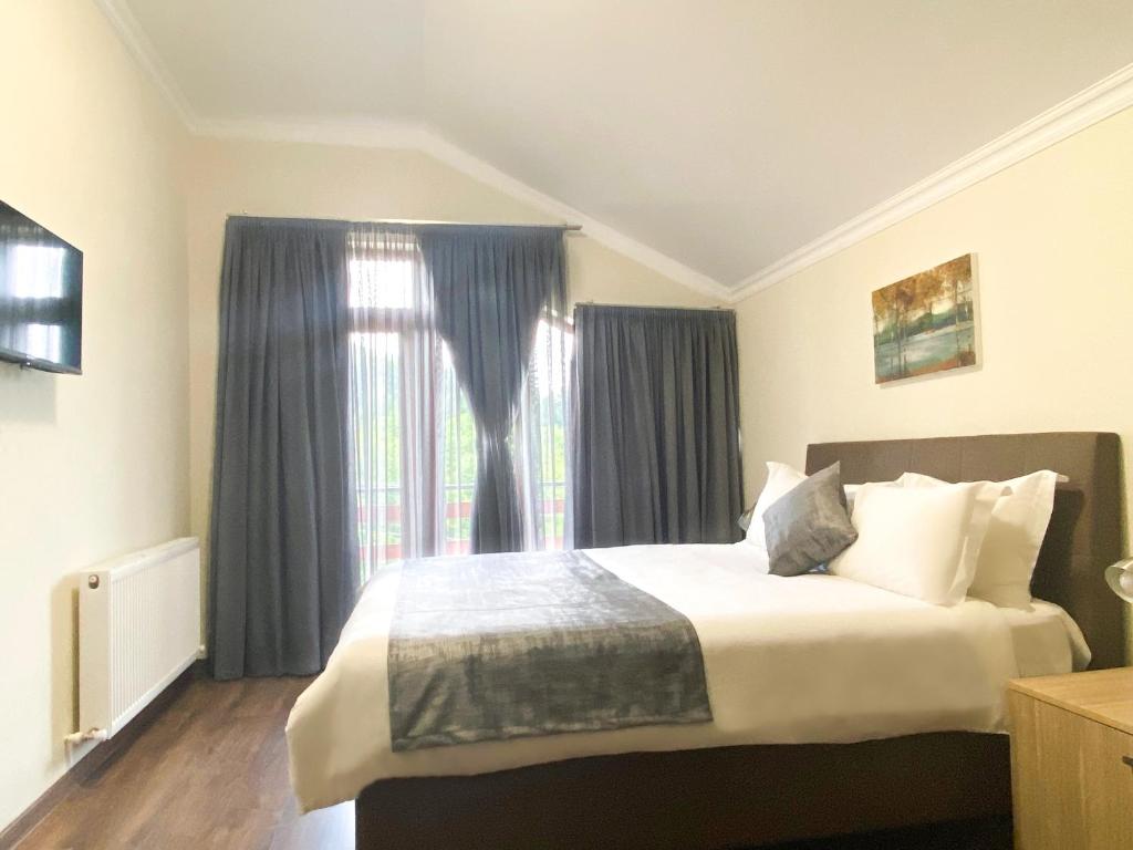 Postel nebo postele na pokoji v ubytování Villa Mtashi