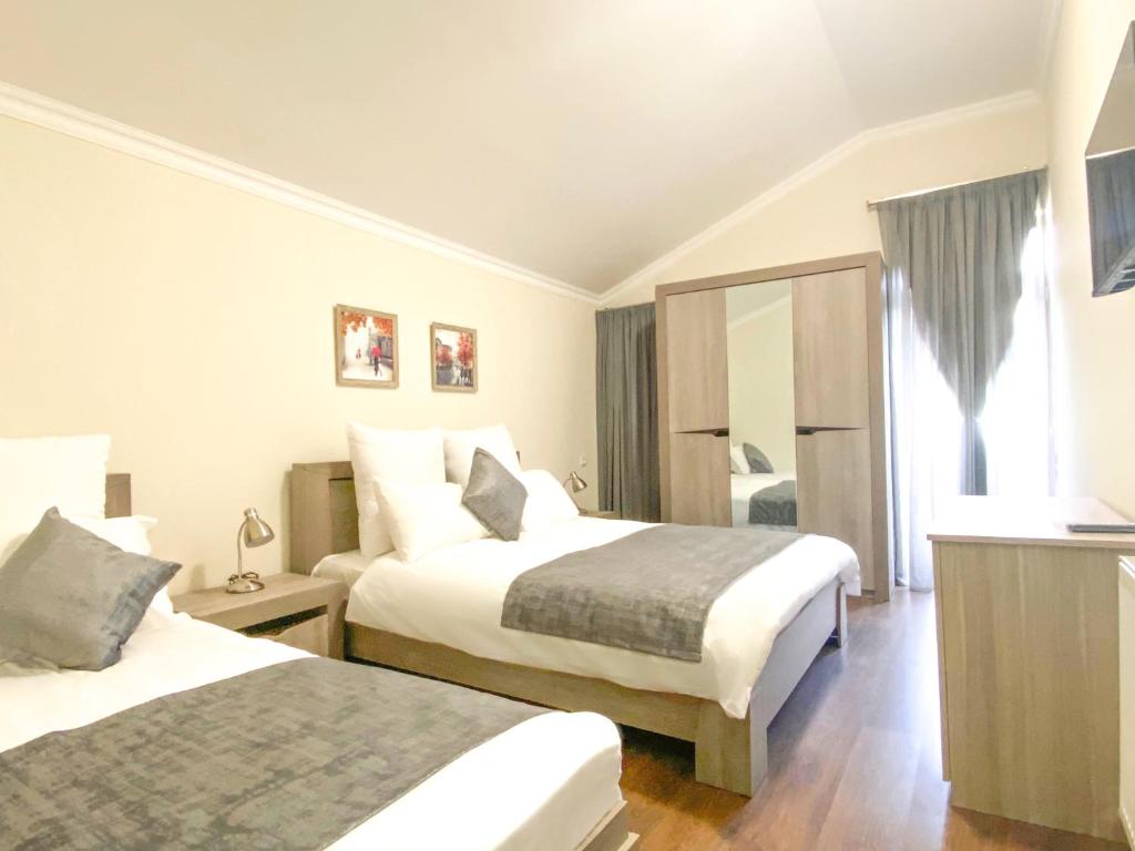 Postel nebo postele na pokoji v ubytování Villa Mtashi