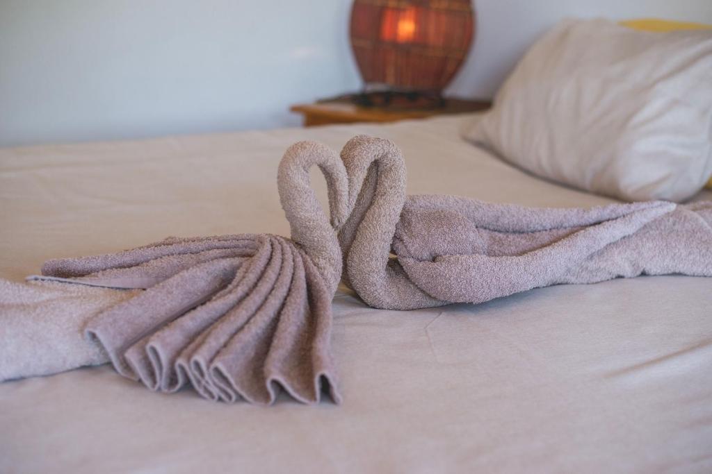 Postel nebo postele na pokoji v ubytování Thokozani Lodge