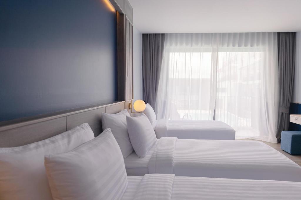 Postel nebo postele na pokoji v ubytování Seabed Grand Hotel Phuket - SHA Extra Plus