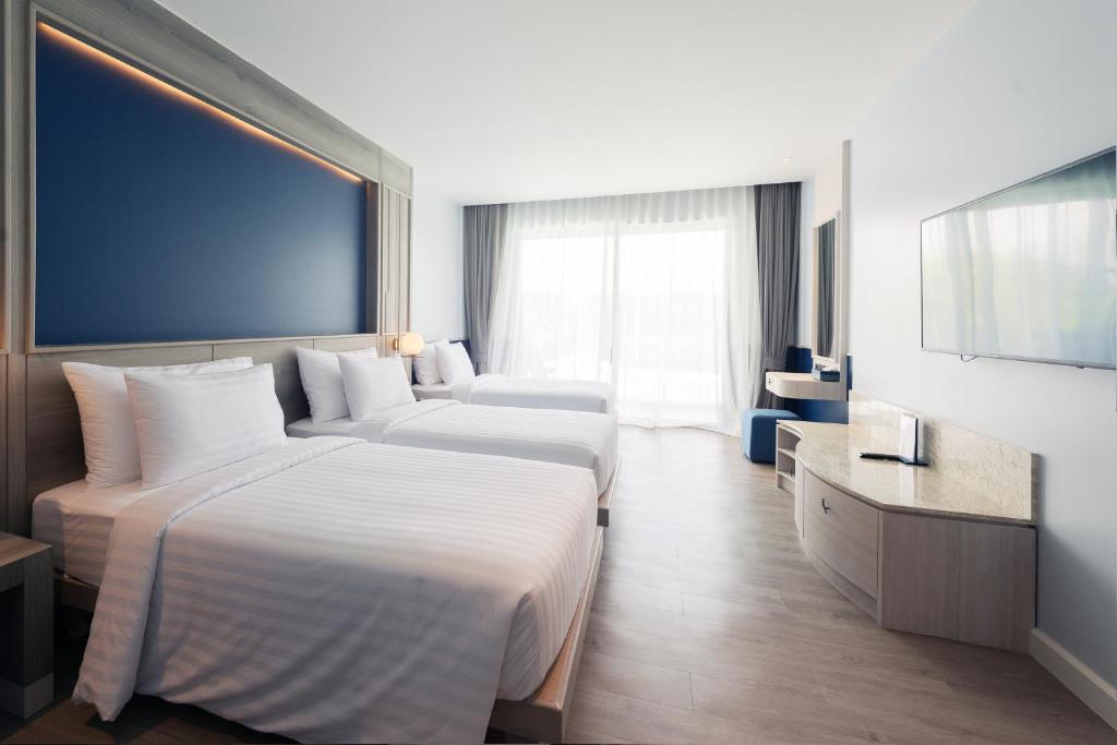 Postel nebo postele na pokoji v ubytování Seabed Grand Hotel Phuket - SHA Extra Plus