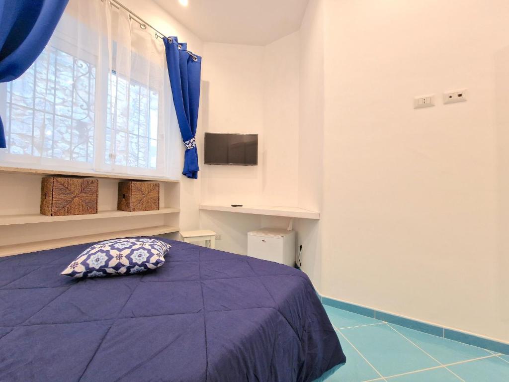 Televiisor ja/või meelelahutuskeskus majutusasutuses Il Cantuccio Rooms